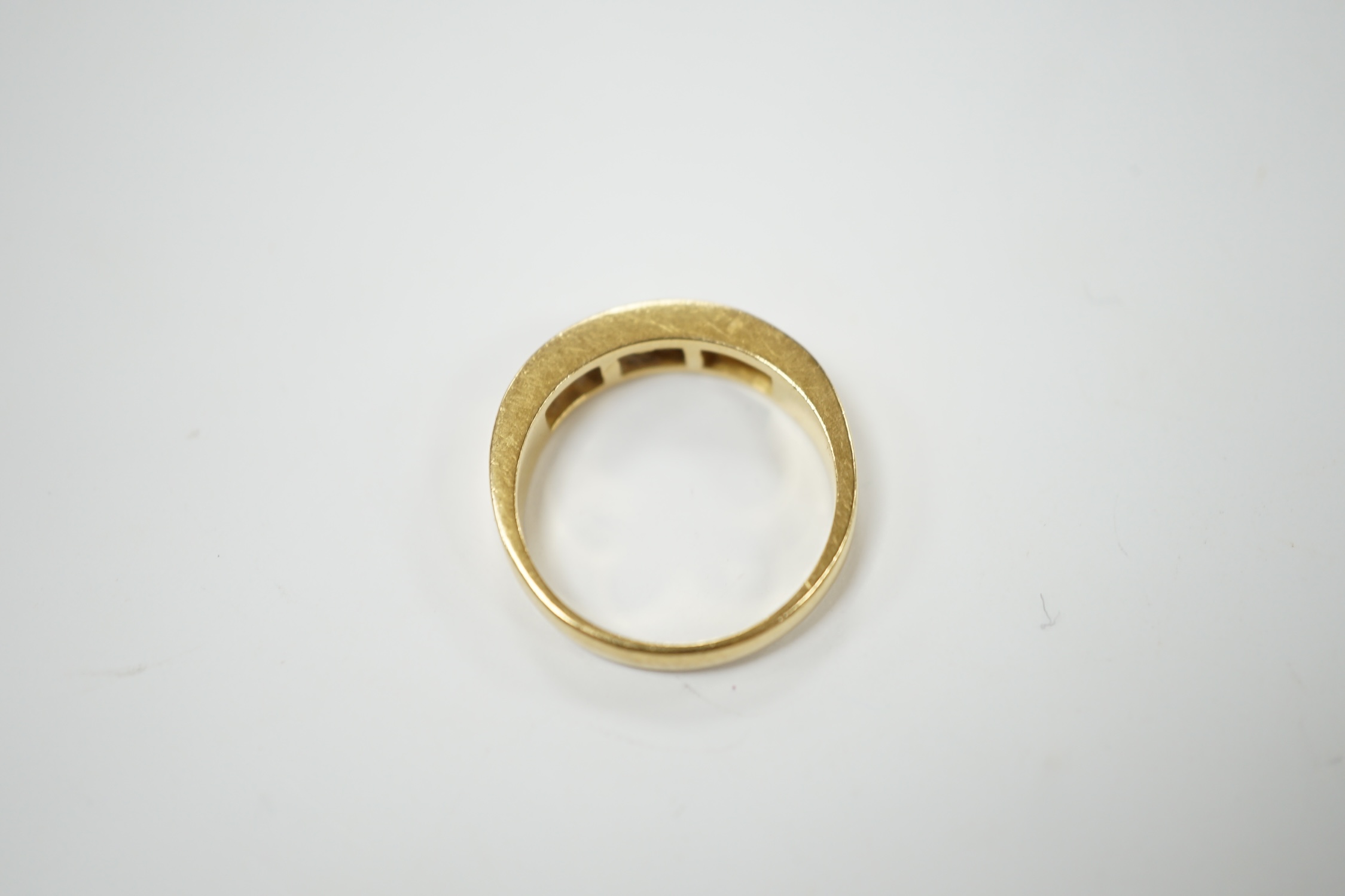 A modern 18ct gold and seven stone channel set diamond half hoop ring, size O, 5.2 grams. Condition - fair to good